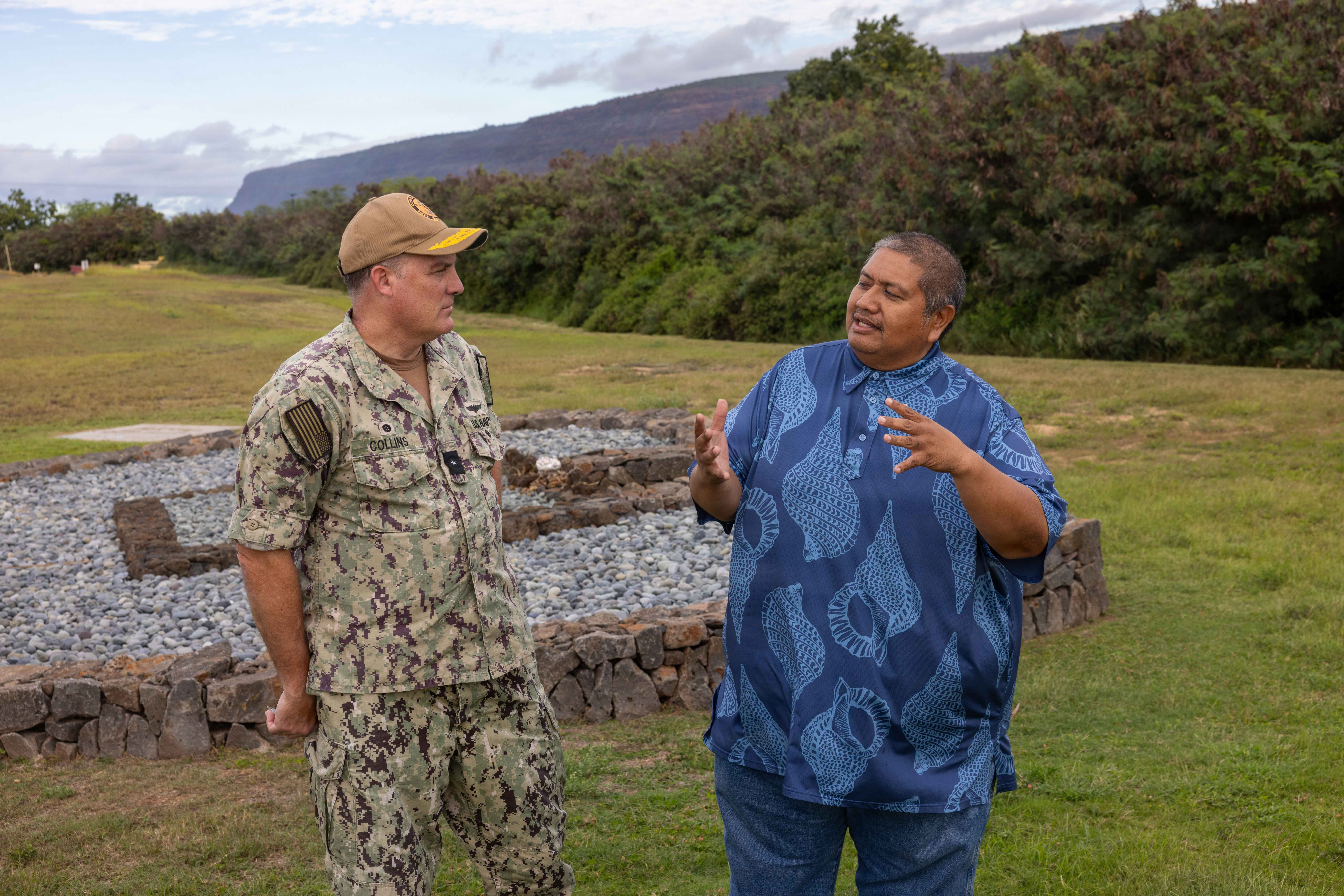 Rear Adm. Collins talks with Thomas Nizo.